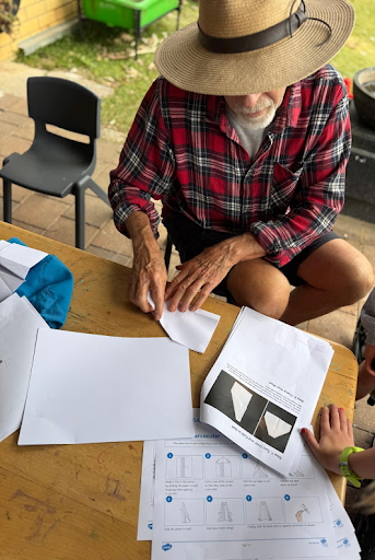A Grand Friend folding paper craft with a child