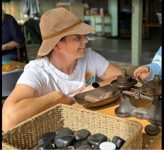 A Grand Friend shaping clay outdoors
